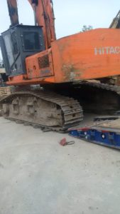 a large orange tractor with tracks