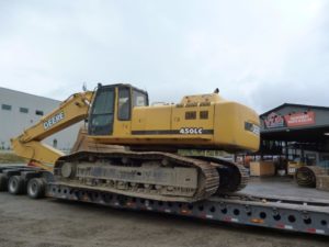 a yellow bulldozer on a flatbed trailer