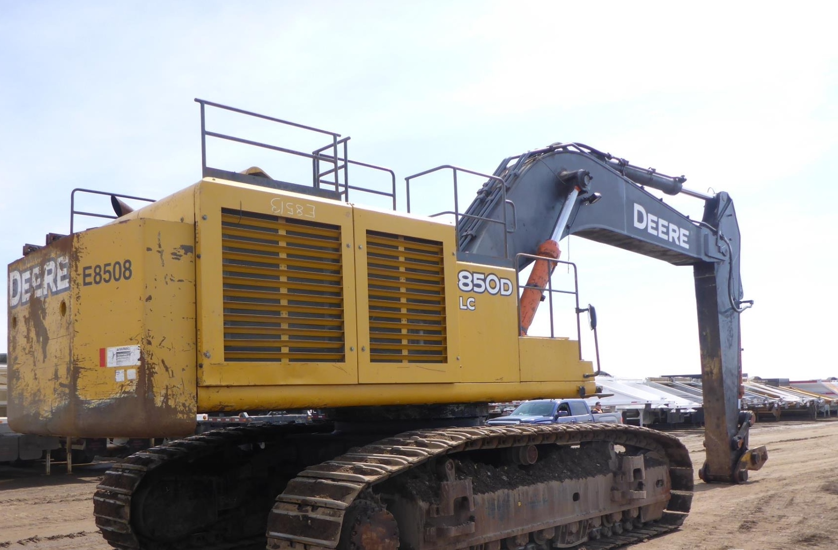 a large yellow machine on a dirt road