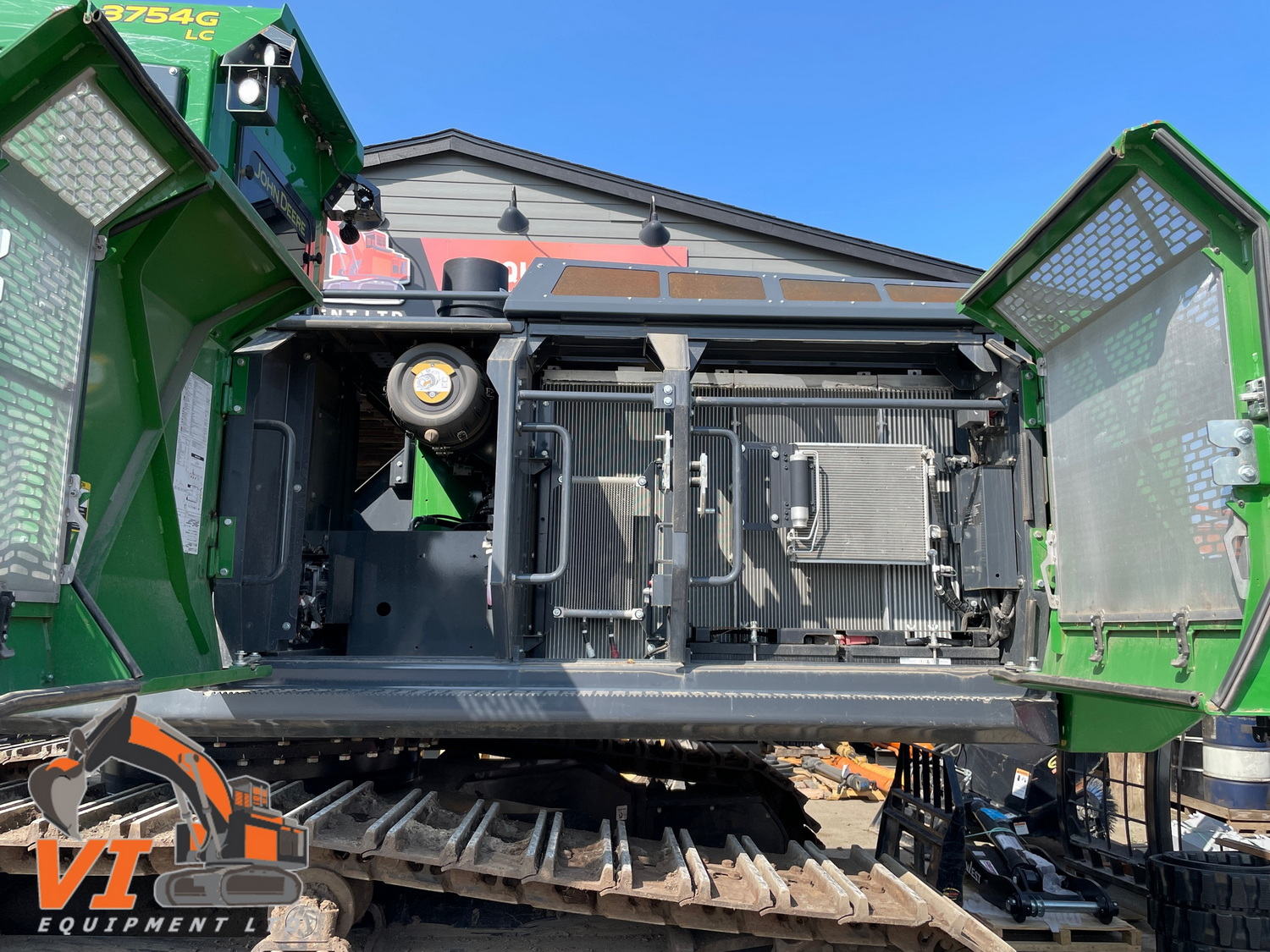 a green machine with a metal door open